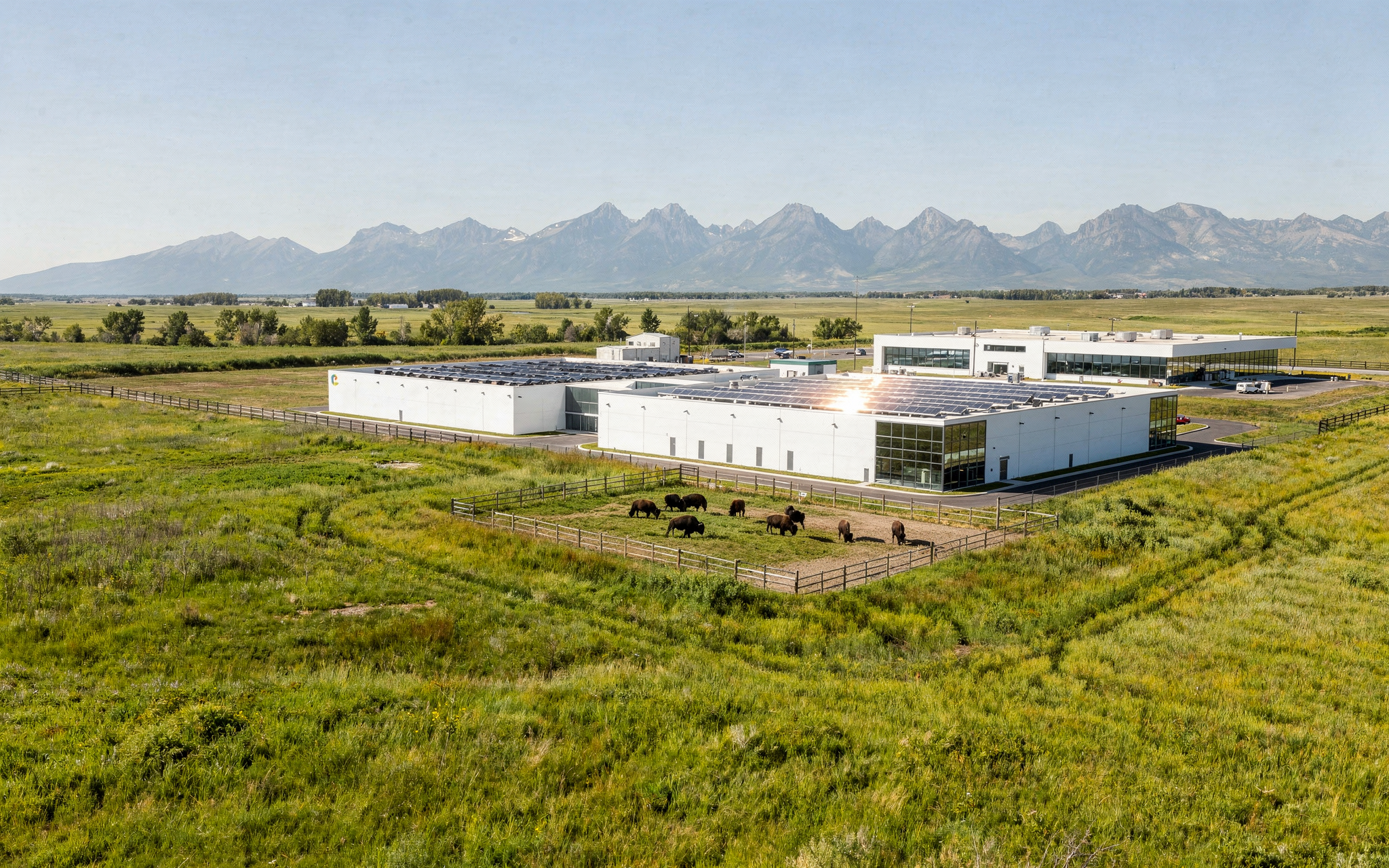 Modern data centre on Alberta farmland under a summer sky